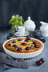 Homemade almond and cherries cake, baked cream with honey and peaches and prunes