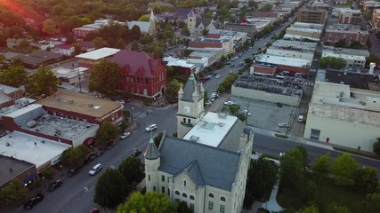 Drone Shot over Downtown and City Hall with Lens Flare