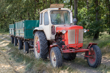Fototapeta premium old tractor with trailers