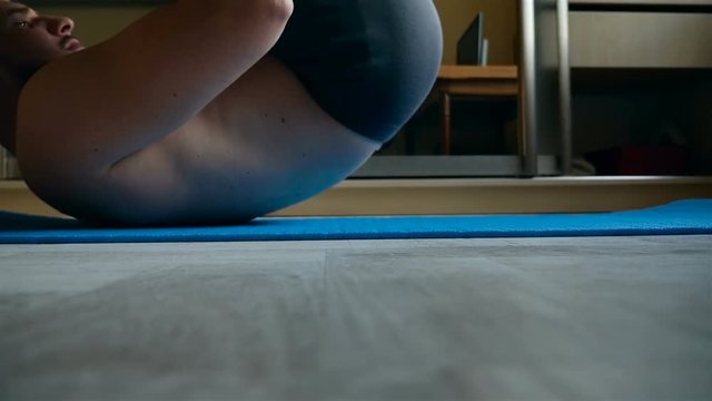 A man is doing exercises for the back. Slow motion