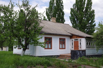 old house with white walls in the park