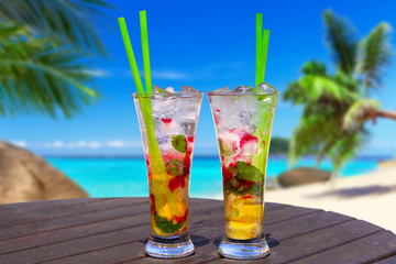 Cocktail glasses at the beach on summer holidays