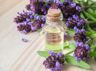 Obraz na płótnie Canvas Medicinal herb. Common self heal (Prunella Vulgaris) scented oil. 