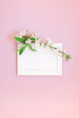 Blank frame mockup with white flowers