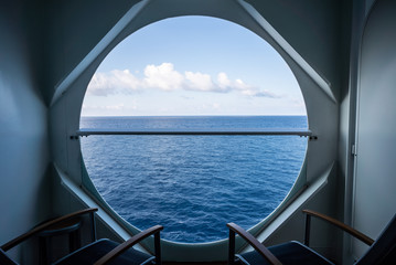 Fototapeta na wymiar balcony with chairs on cruise ship with view on sea