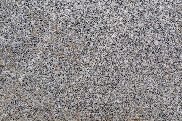 Closeup of natural gray polished granite texture.