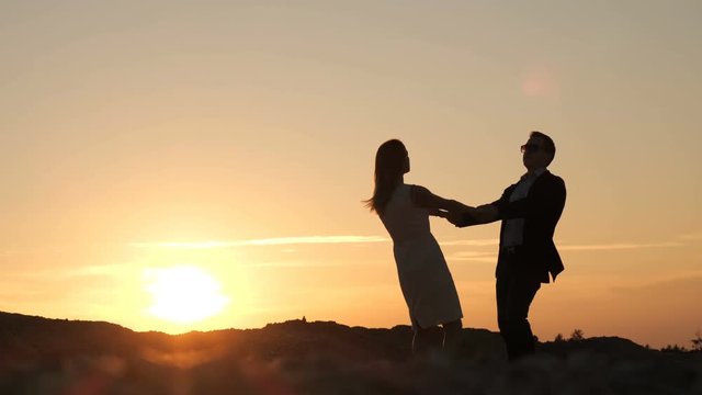 Man and woman at sunset