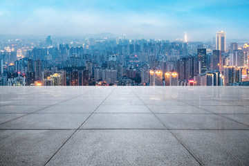 Panoramic skyline and buildings with empty concrete square floor