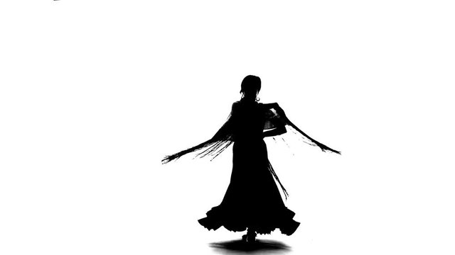 Woman is dancing with a manton in her hands. White background. Silhouette