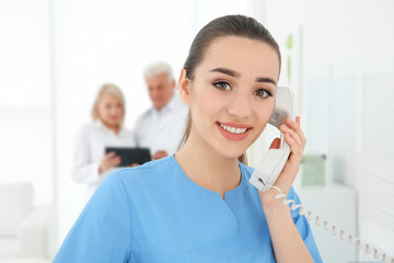 Young female receptionist working in hospital