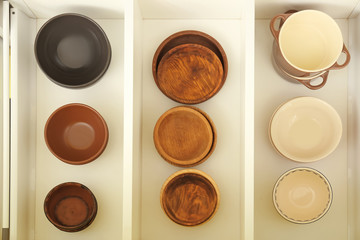 Set of tableware in kitchen drawer