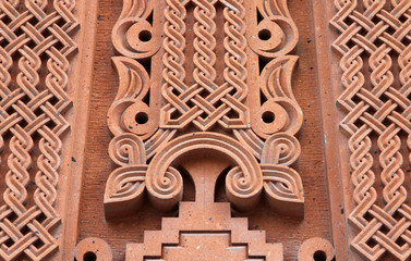 Traditional tufa stone carving ornament on a wall of Armenian Orthodox Church