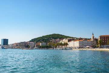 Fototapeta na wymiar Waterfront skyline view on Split town in Croatia with Marjan park in the background