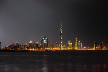 Fototapeta na wymiar Dubai panorama at night, UAE - warm colors 