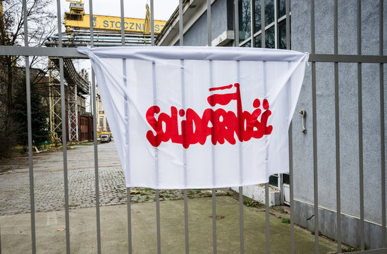 SZCZECIN,POLAND-3.12.2015:Solidarity logo on the flag at the entrance to  shipyard Szczecin