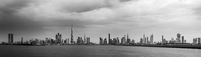Vintage skyline panorama of Dubai city at cloudy day, UAE 
