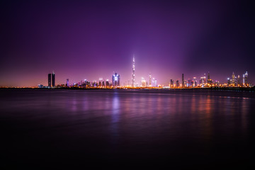 Fototapeta na wymiar Night time skyline panorama of Dubai, UAE