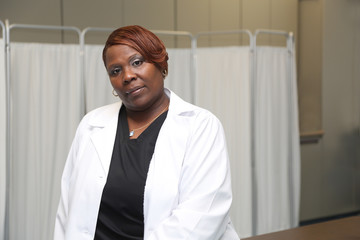 Portrait of a young robust African American woman, portrait of female doctor in a medical clinic