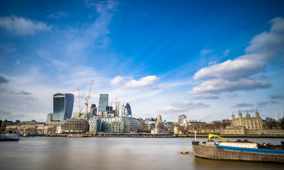 Obraz premium Skyscrapers and cranes in financial district in London. England