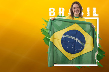 Brazilian woman fan, celebrating on a yellow background. Copy Space.