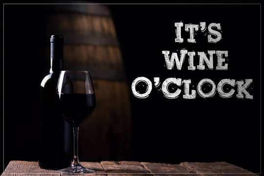 It' S Wine O Clock. A Bottle Opf Red Wine And A Glass With Barrel On Background