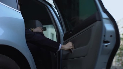 Man getting out of car, personal chauffeur bringing businessman to office, taxi