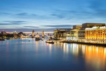 Fototapeta na wymiar Tower Bridge seen across river Thames at dawn. England