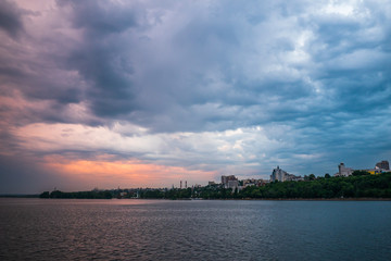 Fototapeta premium Beautiful dramatic storm clouds over Voronezh city, Russia. Panorama landscape with river and cloudscape