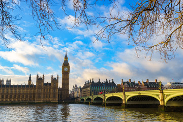 Elizabeth tower known as Big Ben and Westminster bridge in afternoon light in London. England