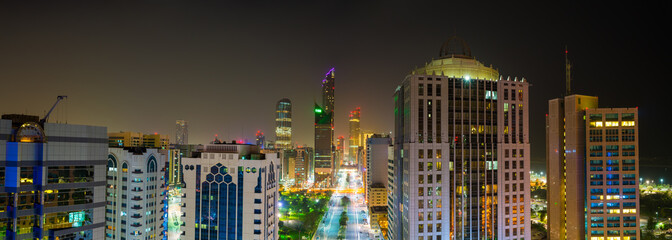 Aerial panorama of Abu Dhabi downtown at night, UAE