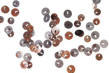 Old rusty metal thumbtacks, isolated on white background