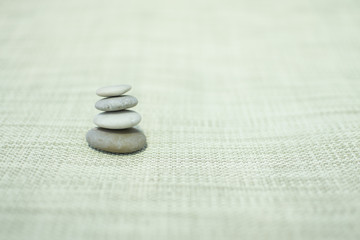 Fototapeta na wymiar stones on straw background
