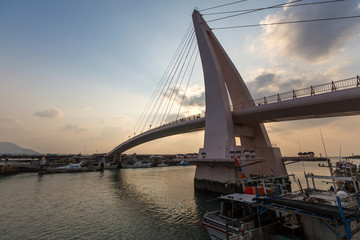 Fototapeta na wymiar Pedestrian bridge at fisherman's wharf (lovers bridge) danshui/tamsui at sunset. Taipei, Taiwan