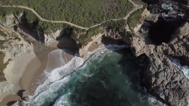 Aerial of small patch of Big Sur Coast and hiking area