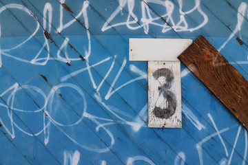 Graffiti on warehouse door and number 3