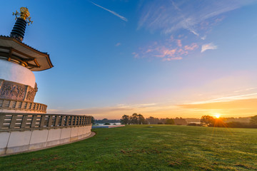 Fototapeta na wymiar Willen Lakeside Park with Peace Pagoda Temple and beautiful sunrise sky in Mlton Keynes, United Kingdom