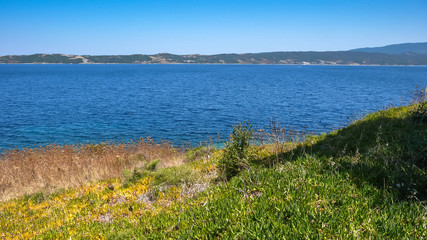 Fototapeta na wymiar Coastline of Ammouliani island, Athos, Chalkidiki, Central Macedonia, Greece 