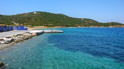 Fototapeta na wymiar Coastline of Ammouliani island, Athos, Chalkidiki, Central Macedonia, Greece 