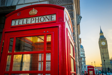 Fototapeta na wymiar Red telephone box at sunrise in London,England