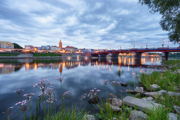 Evening skyline of Gorzow city in Poland. Old town bridge and St. Mary's cathedral
