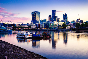 Fototapeta premium London financial district during sunrise with its reflection from river Thames