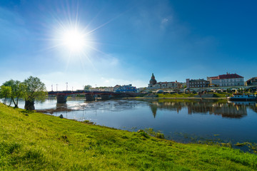 Cityscape of Gorzow Wielkopolski with sun flare and blue sky 