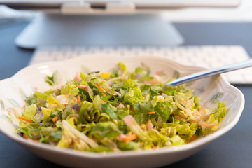 Fresh salad on the plate, close up.