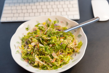 Fresh salad on the plate, close up.