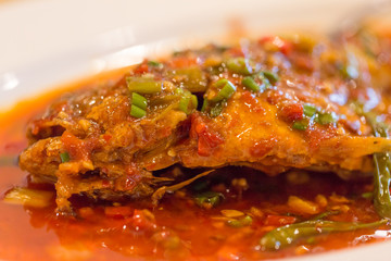 Authentic Sichuan style spicy Chinese food on the table, closeup.