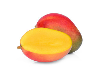 whole and half ripe mango isolated on white background
