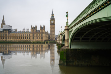 Big Ben, Westminster Palace and bridge with reflection 