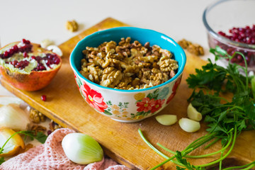 Walnuts in ceramic bowl good for salads, lunch or dinner meal and desserts. Raw vegan vegetarian healthy food.