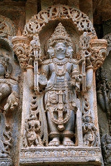 Fototapeta na wymiar Ornate wall panel reliefs depicting lord Brahma, North wall, Kedareshwara temple, Halebidu, Karnataka