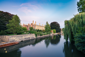 View of Cam river and the ornamented facade of Clare College at sunrise in Cambridge, UK